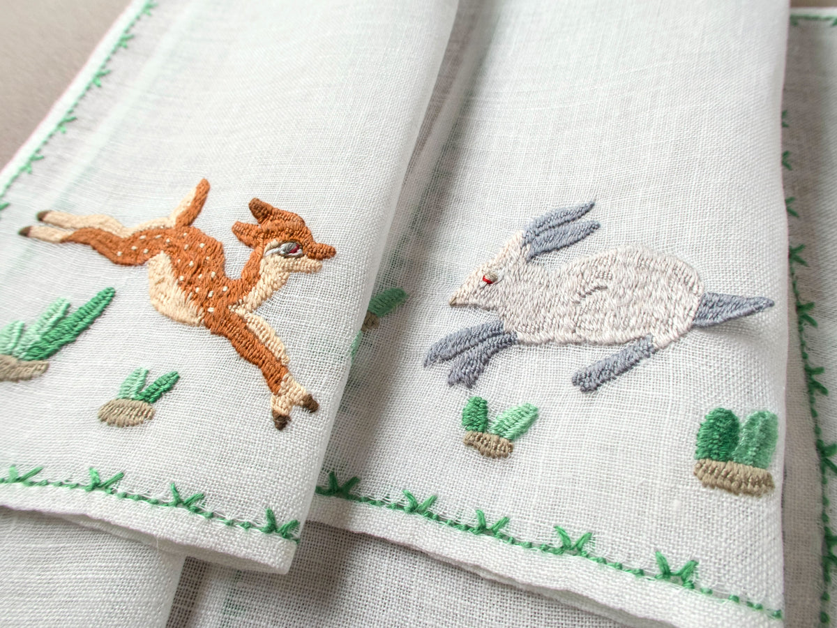 Vintage Rapisardi cocktail napkins with embroidered deer and rabbit with  landscape details.