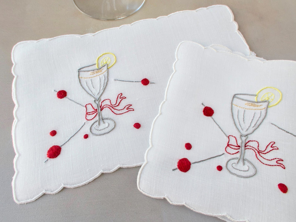 Vintage Madeira cocktail napkins, white Irish linen with scalloped edges, embroidered cocktail glass with red bow, lemon slice and cherry picks​​​​​​​​​​​​​​​​