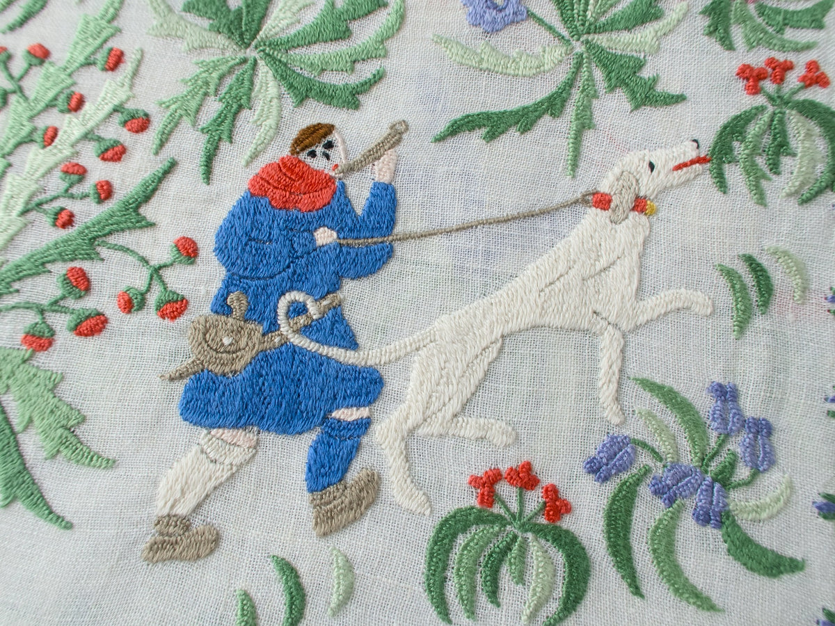 Rapisardi placemat showing embroidered medieval hunting figure with dog in a forest setting