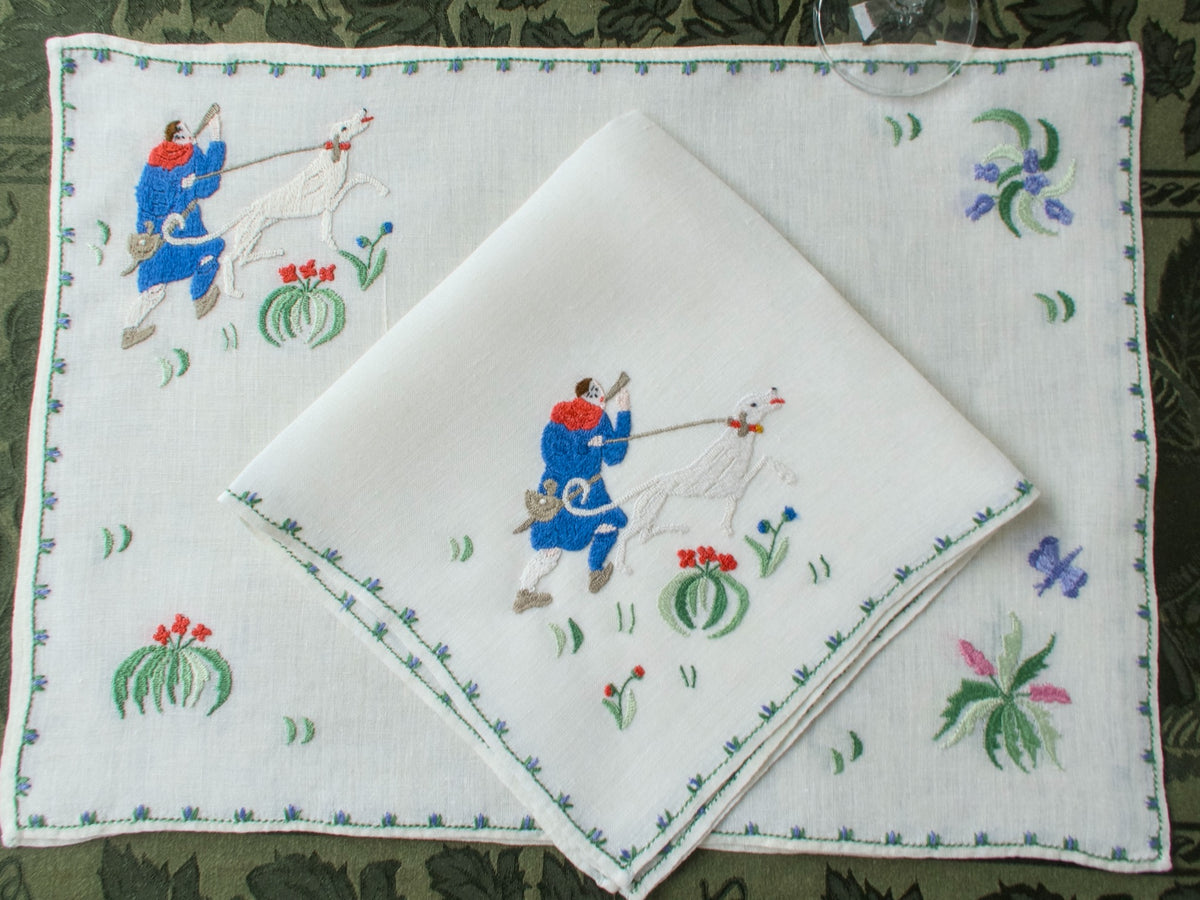 Vintage Rapisardi placemat and napkin showing embroidered medieval hunting figure with dog.