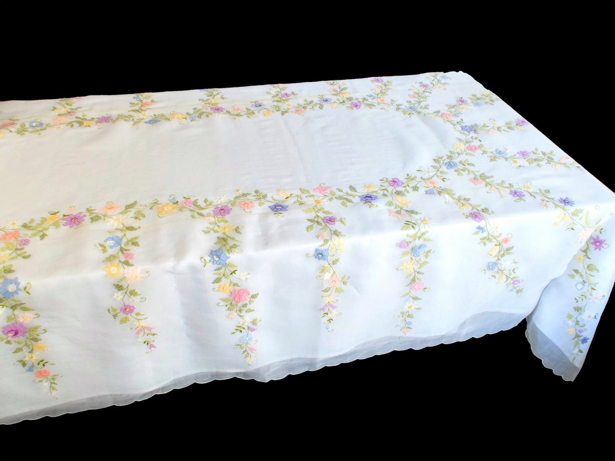 Vintage hand-embroidered organdy tablecloth with pastel floral garlands