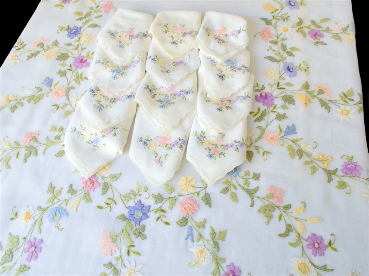 Matching napkins in soft cotton voile with coordinating floral embroidery