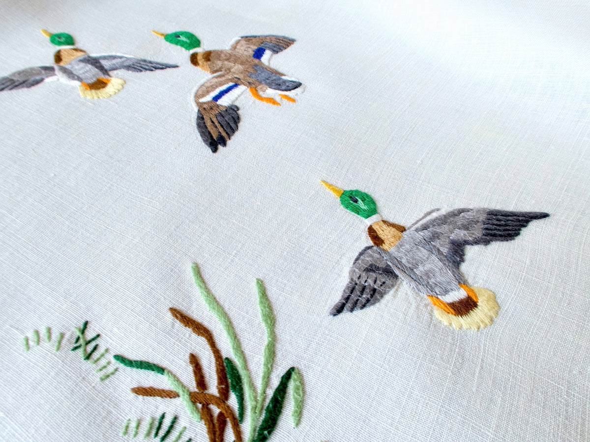 Vintage Madeira tablecloth embroidered with colorful mallards in flight and among marsh grasses