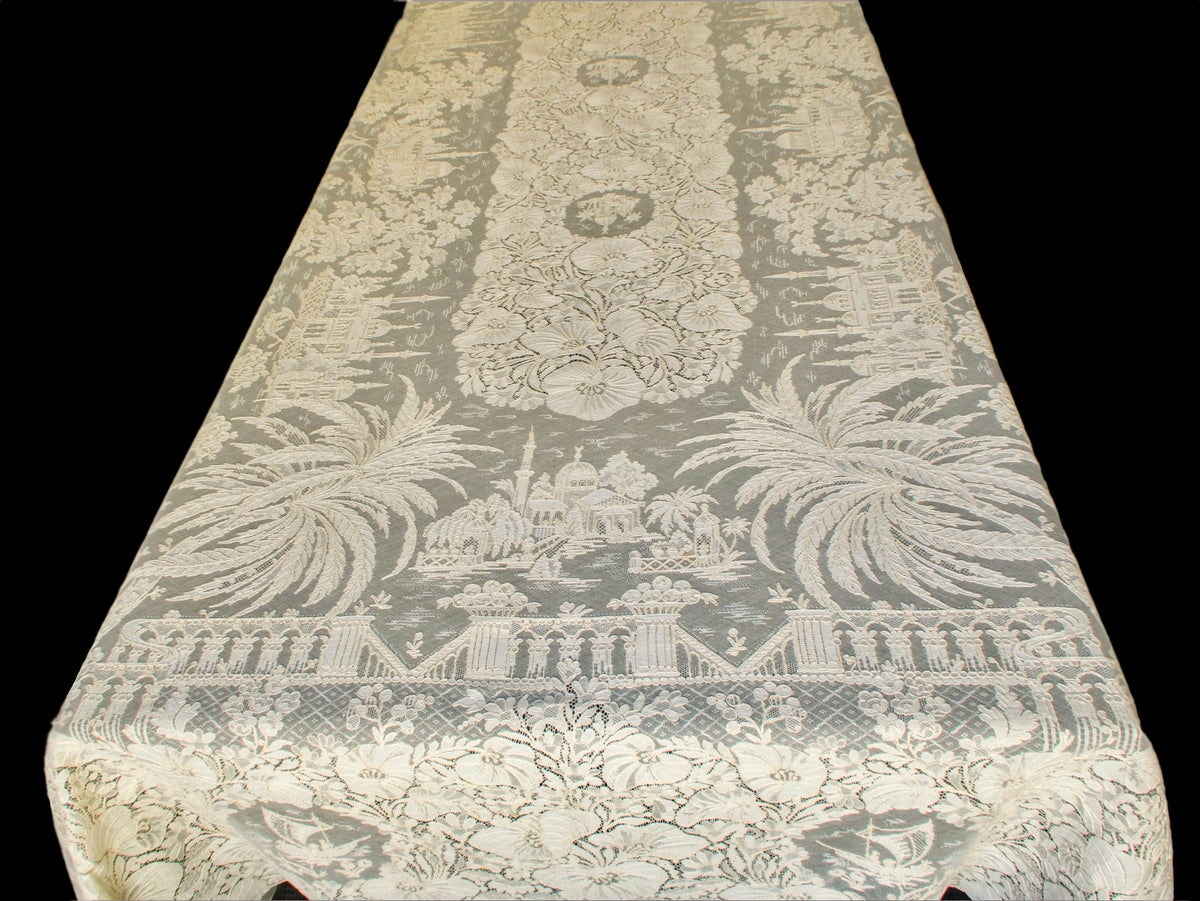 Top view of Venetian motifs on a vintage French Alençon lace tablecloth