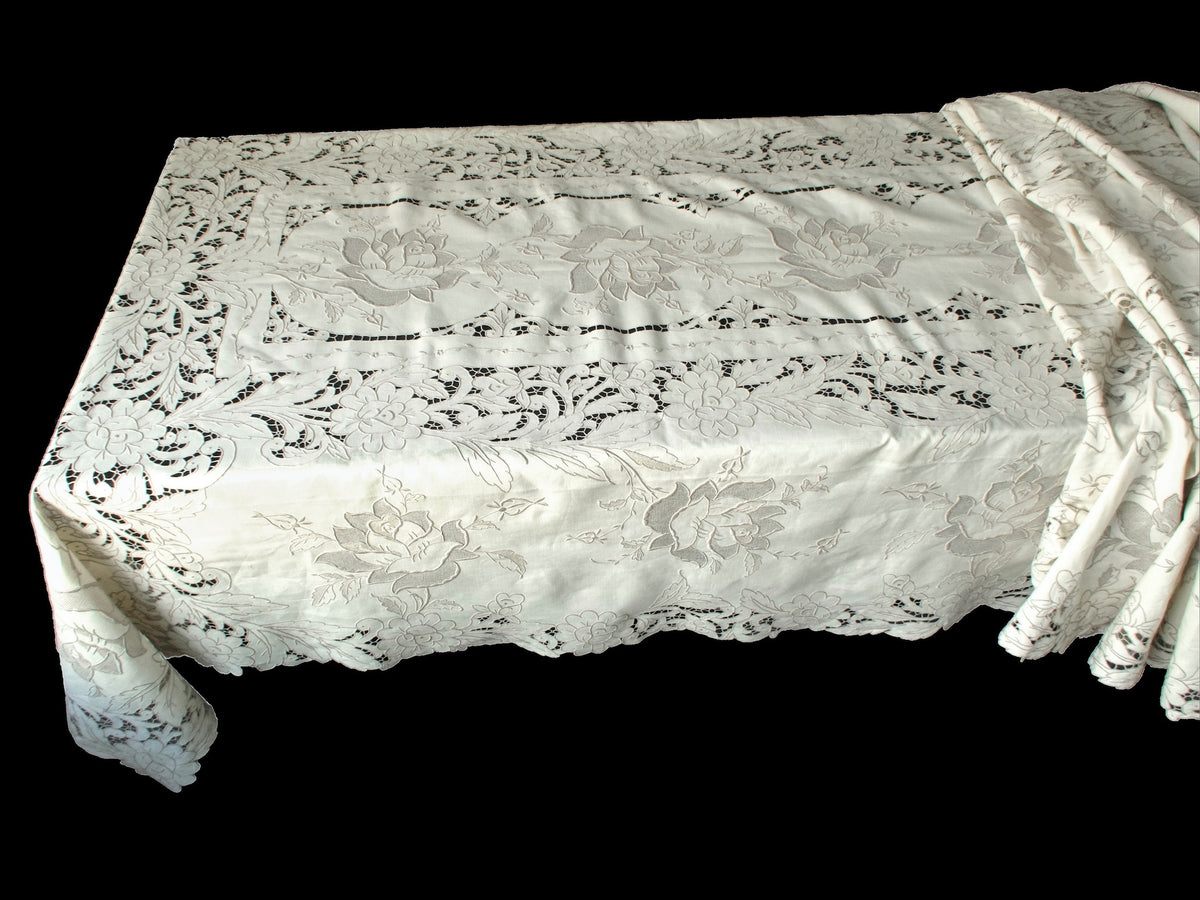 Corner of large Madeira tablecloth showing dense floral embroidery and intricate connecting bars.