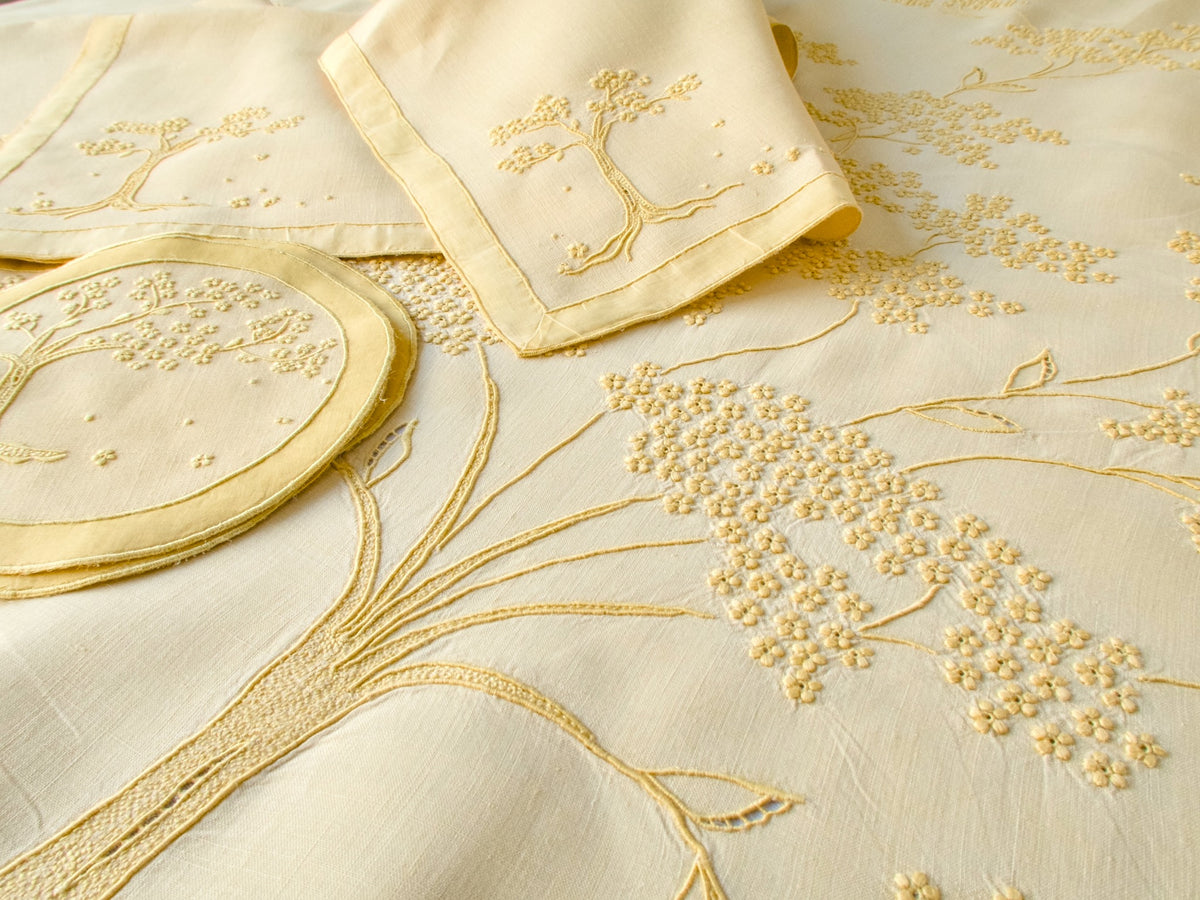 Vintage yellow Marghab Jacaranda Tree tablecloth with matching napkins and coasters, hand embroidered in Madeira