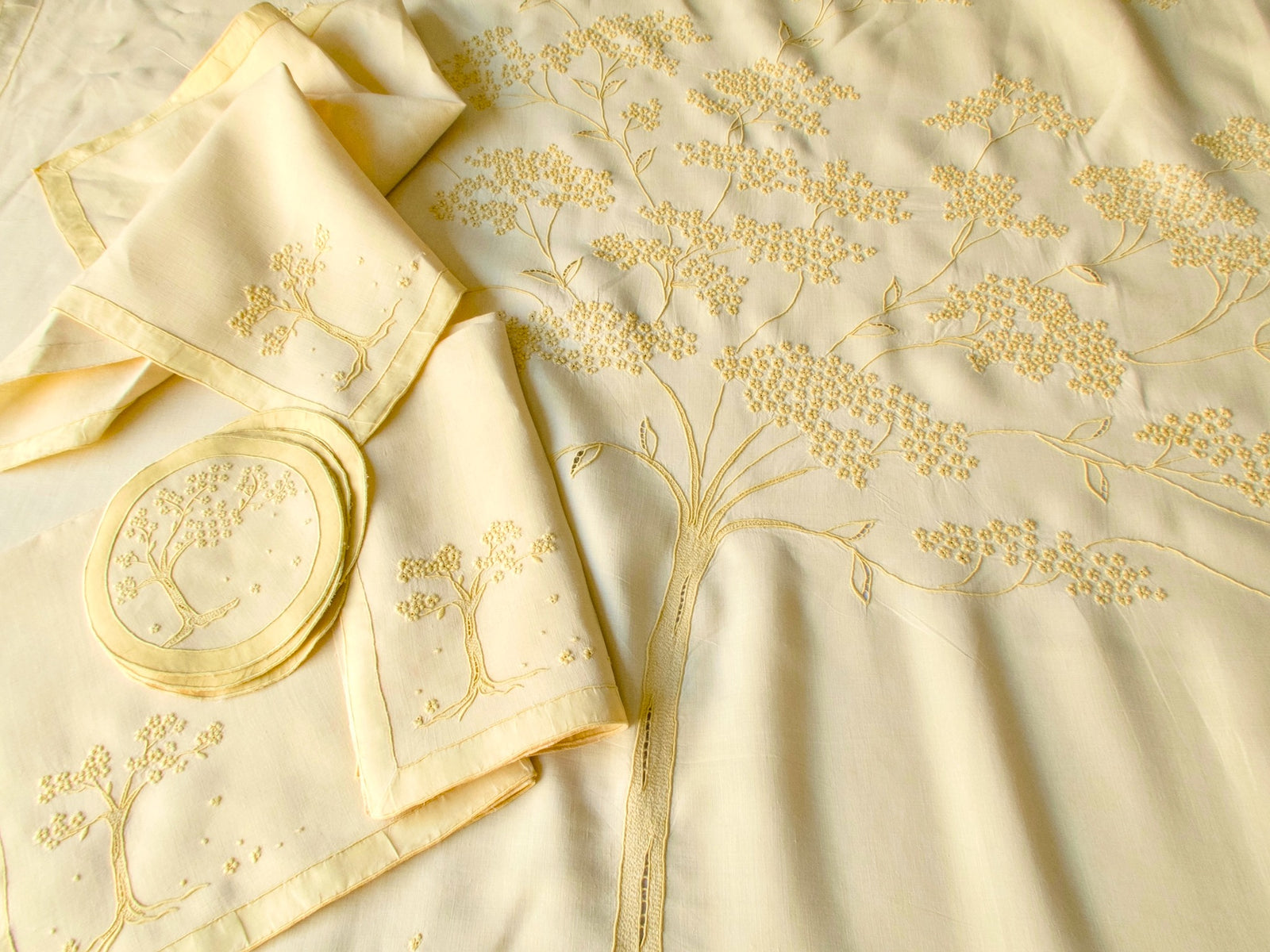 Set of vintage Marghab napkins and coasters with Jacaranda Tree embroidery on yellow linen