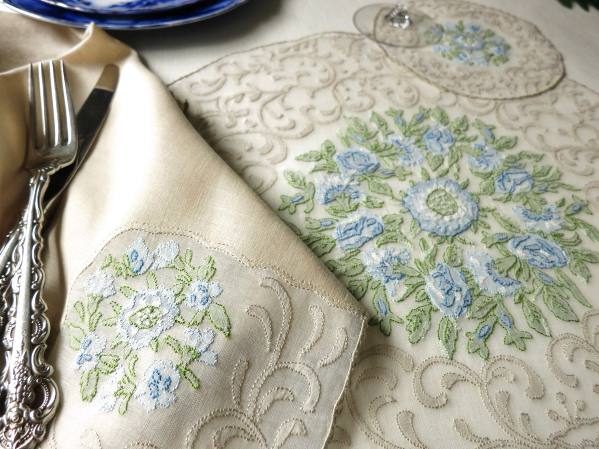 Vintage Madeira linen placemat and napkin with blue and green floral embroidery, hand embroidered in shadow work on organdy.