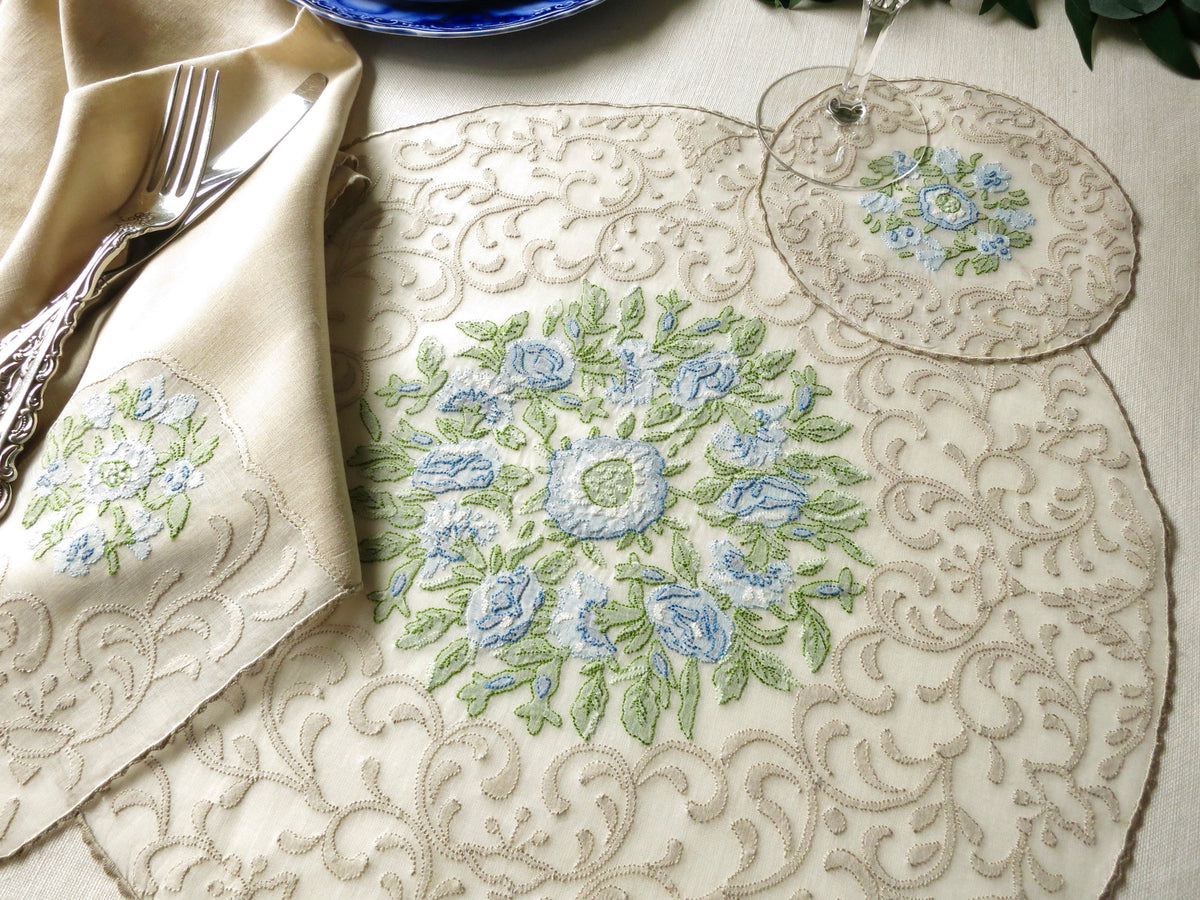 Vintage Madeira linen placemat and napkin with blue and green floral embroidery, hand embroidered in shadow work on organdy.