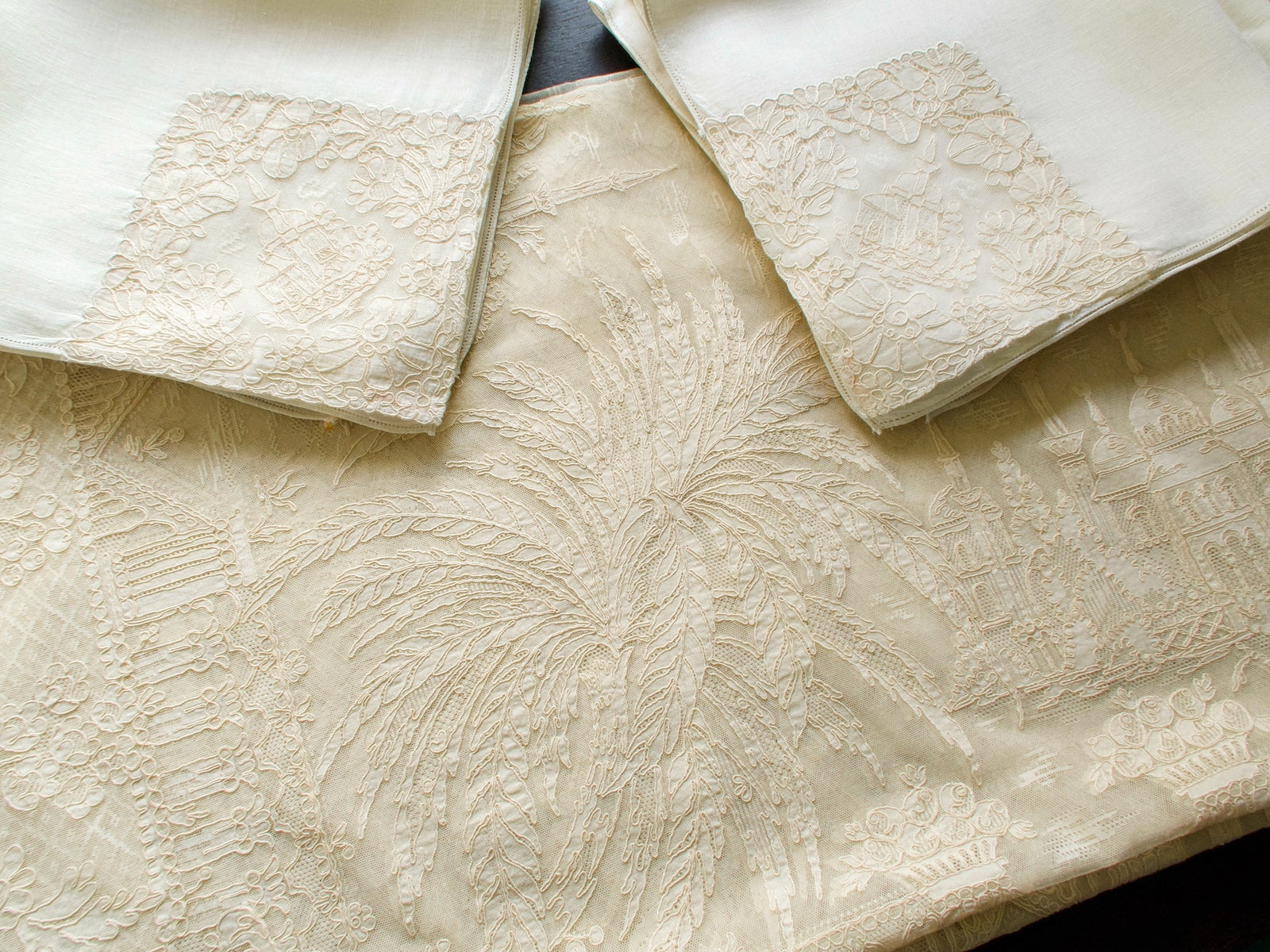 Matching napkins with church and tower motifs, vintage French lace