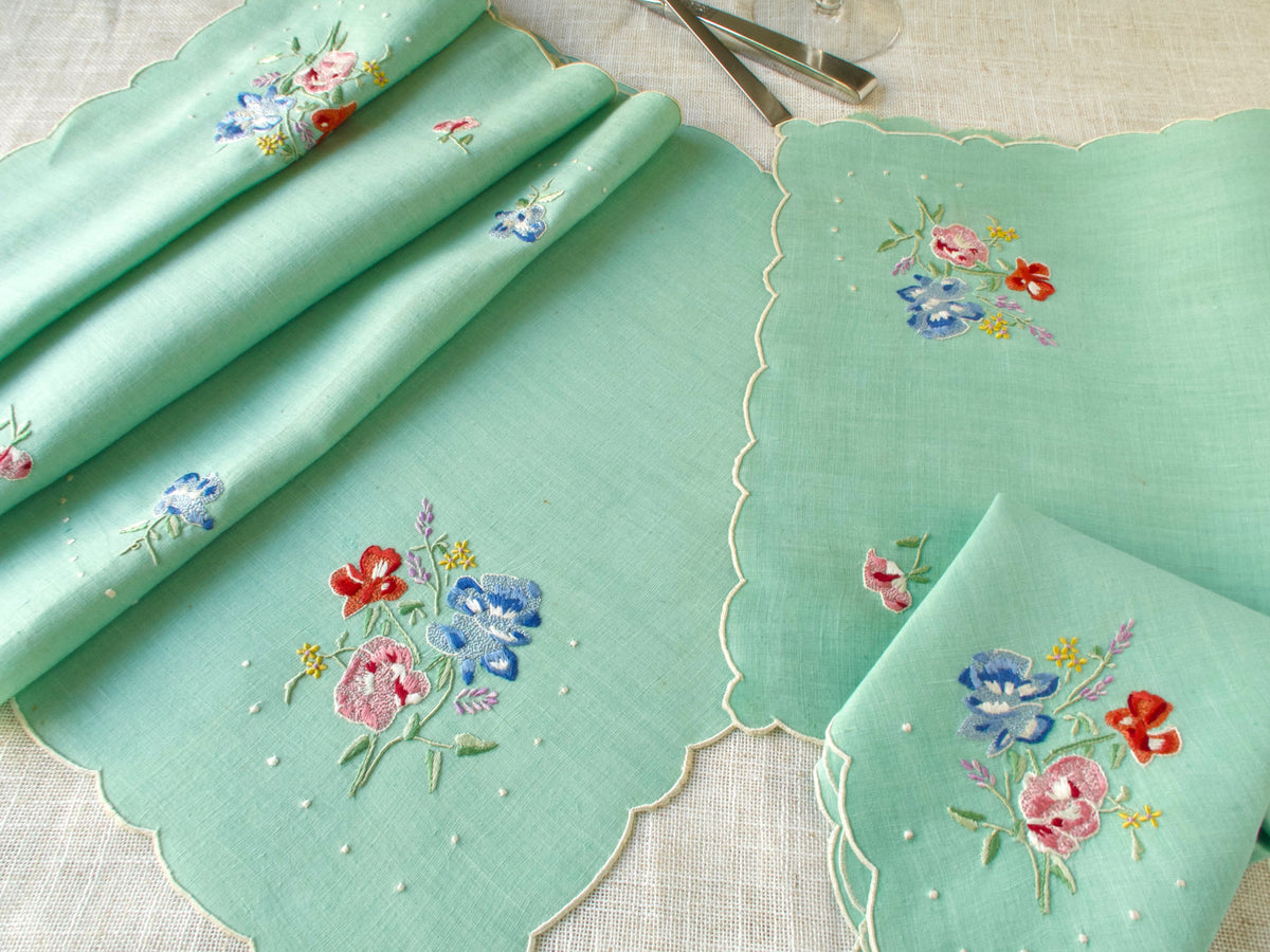 Set of green Madeira placemats and napkins with coordinating runner