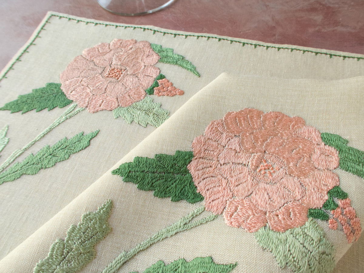 Close up of pink hydrangea embroidery on vintage Rapisardi linen placemat with dimensional stitching