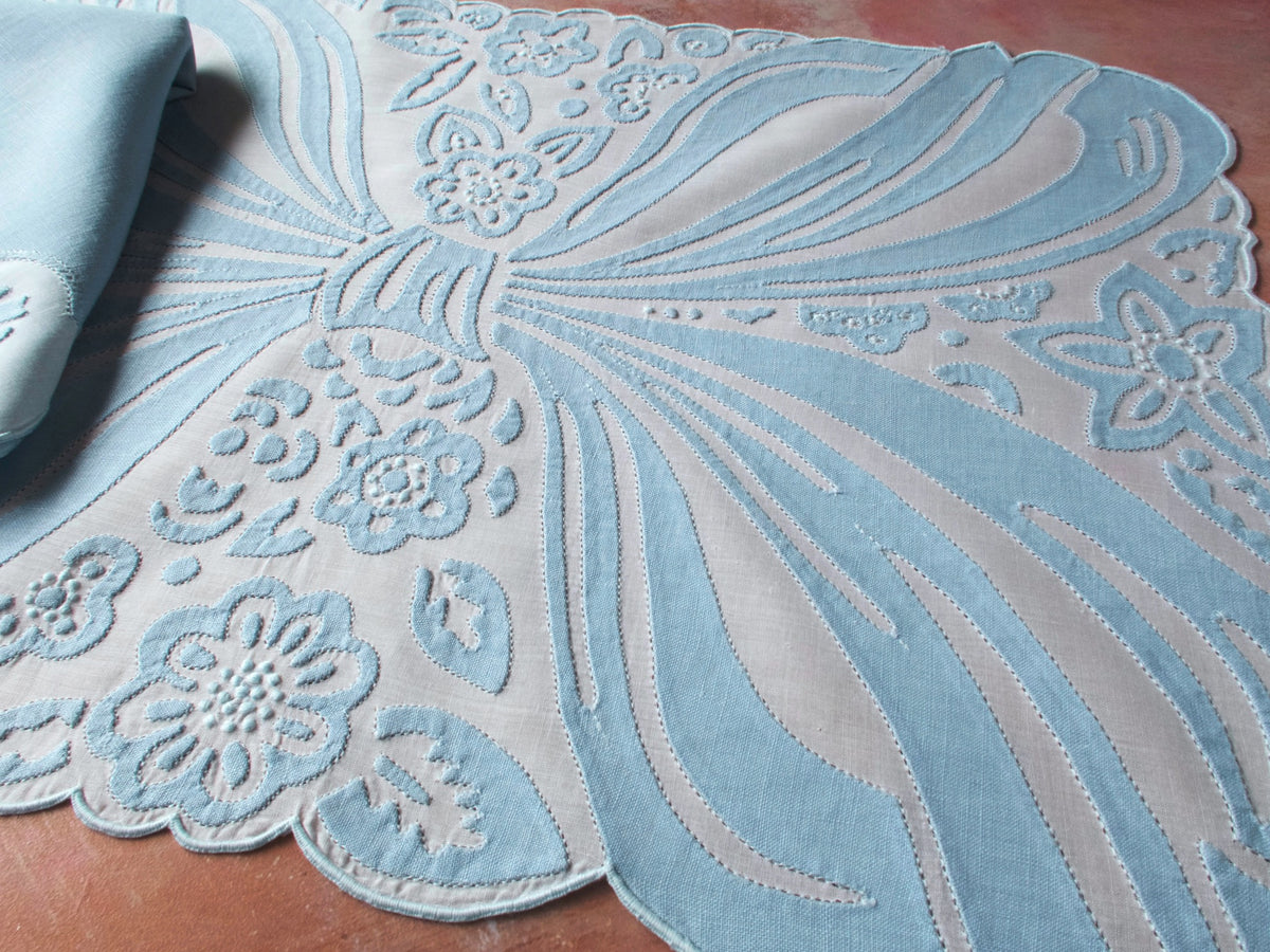 Ornate blue bow in embroidery and applique, vintage Madeira handwork.