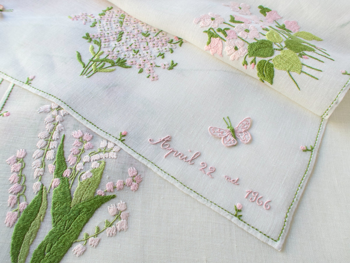 Rapisardi table runner embroidered “April 22, 1966,” likely a wedding date, with pink floral motif and trembler butterfly.