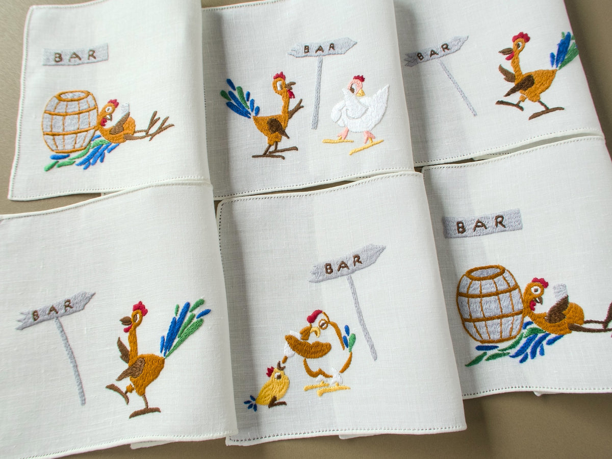 Set of six vintage Rapisardi hand embroidered linen cocktail napkins, each with a different rooster and hen scene