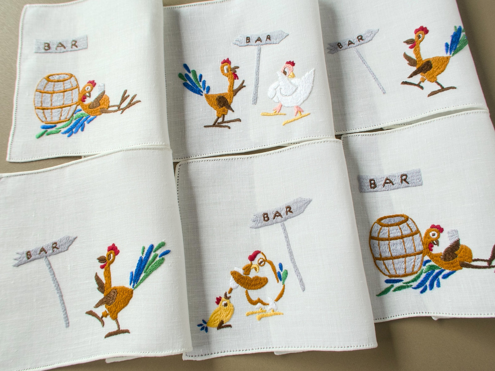 Set of six vintage Rapisardi hand embroidered linen cocktail napkins, each with a different rooster and hen scene