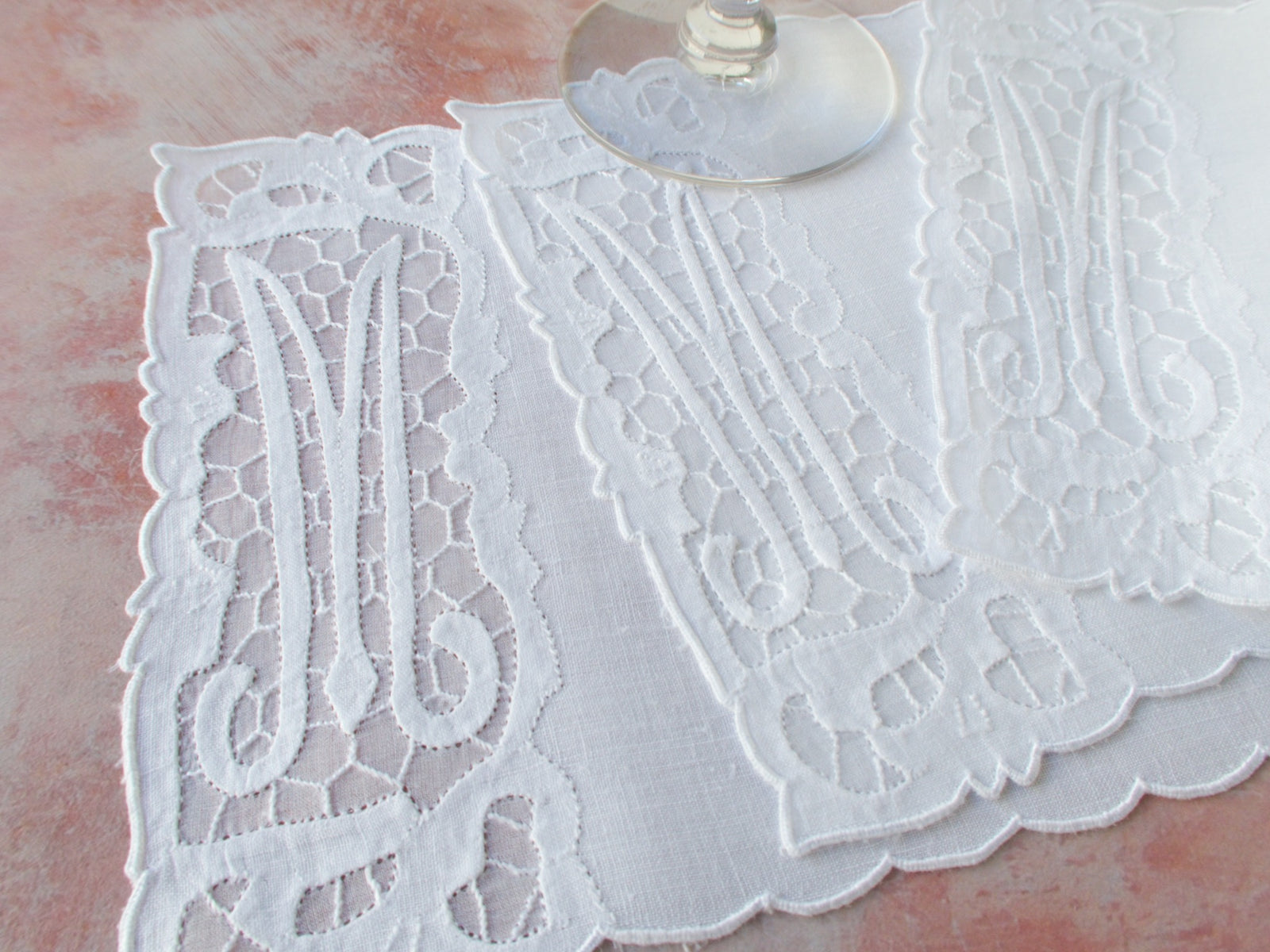 elaborate vintage linen cocktail napkin with an embroidered M monogram