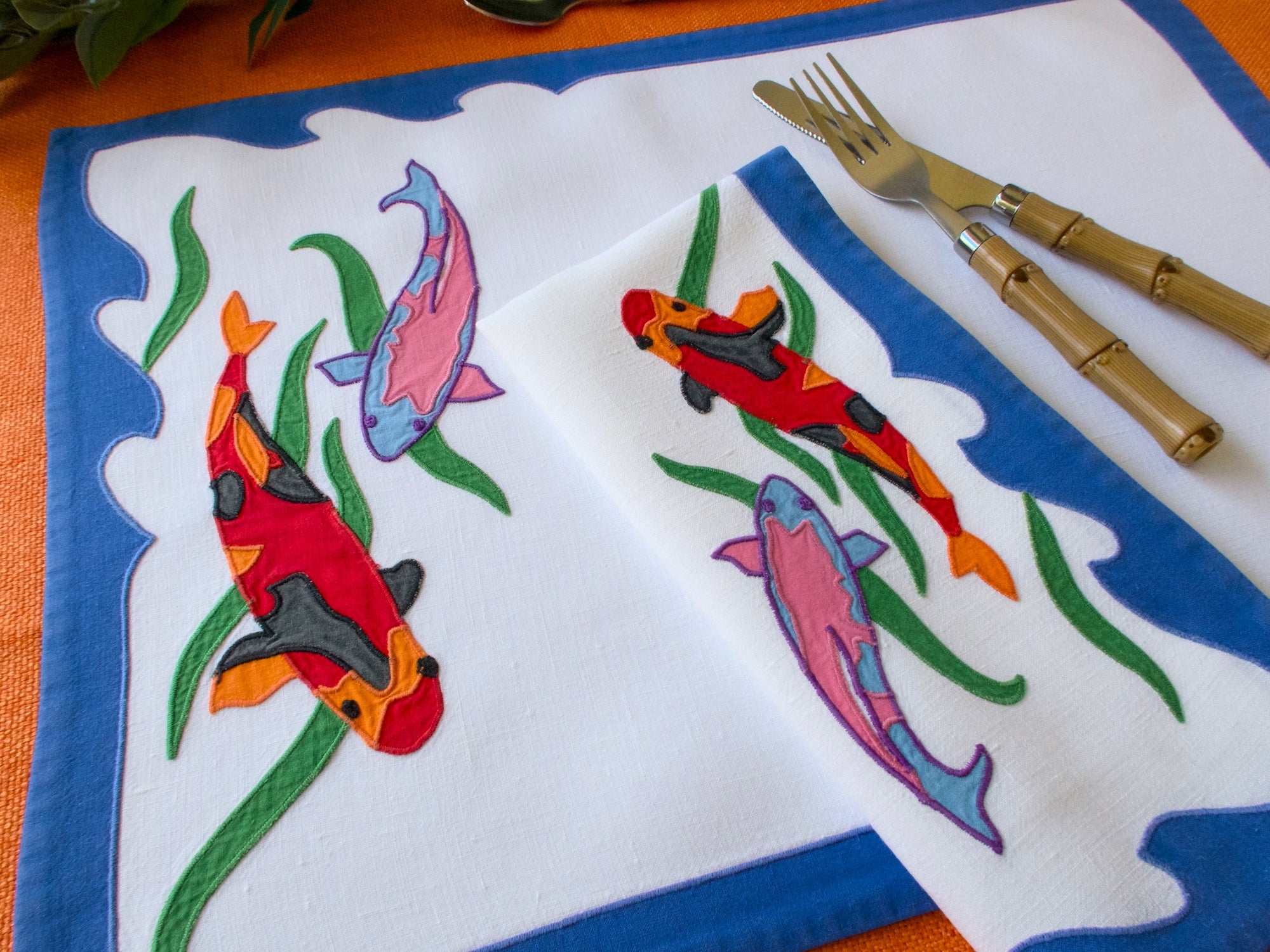 embroidered fish on linen placemats