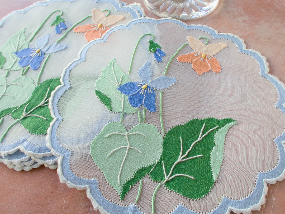 Vintage Madeira organdy cocktail round with blue and coral floral linen appliqué and Caseado Bastido edging.