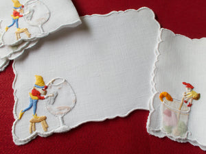 Elves help at the bar, embroidered vintage cocktail napkins.