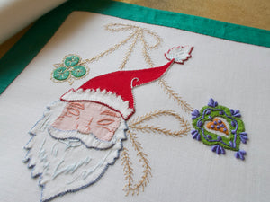 Vintage placemat set with embroidered Santa