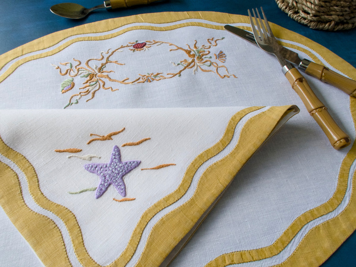 starfish embroidered napkin on a placemat