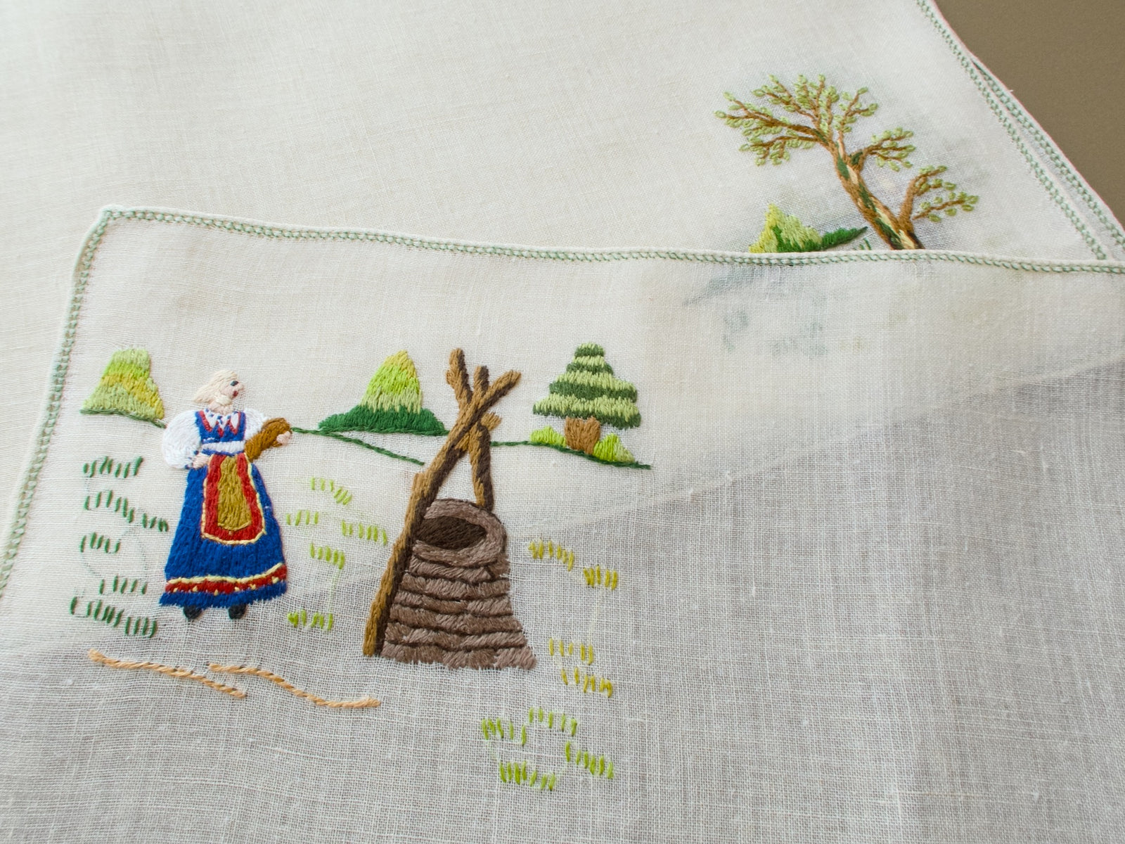 Vintage Italian Rapisardi placemat with stylized landscape, trees and woman at a well