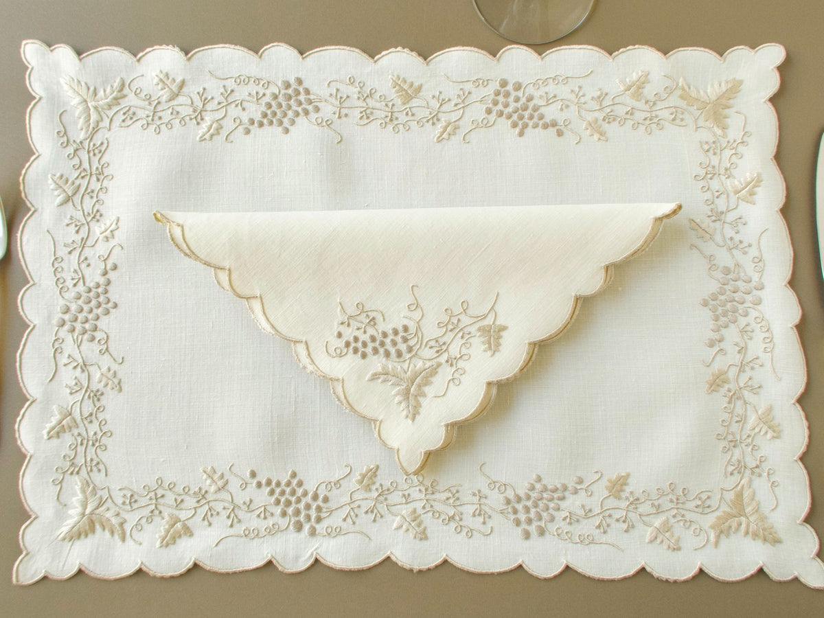 Vintage Madeira placemat and napkin set with embroidered grapevine design and scalloped edges
