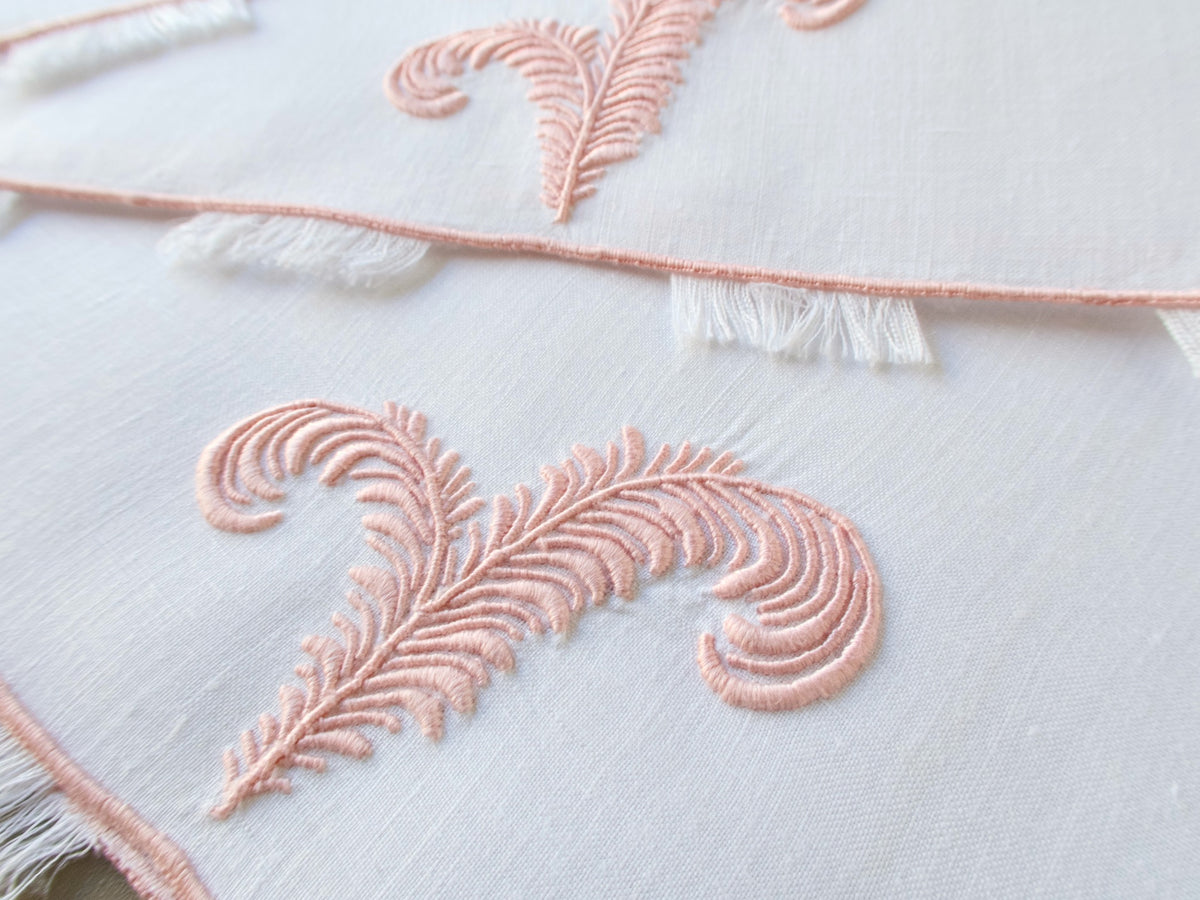 Close view of a dimensional feather plume embroidered on a vintage Marghab linen fingertip towel
