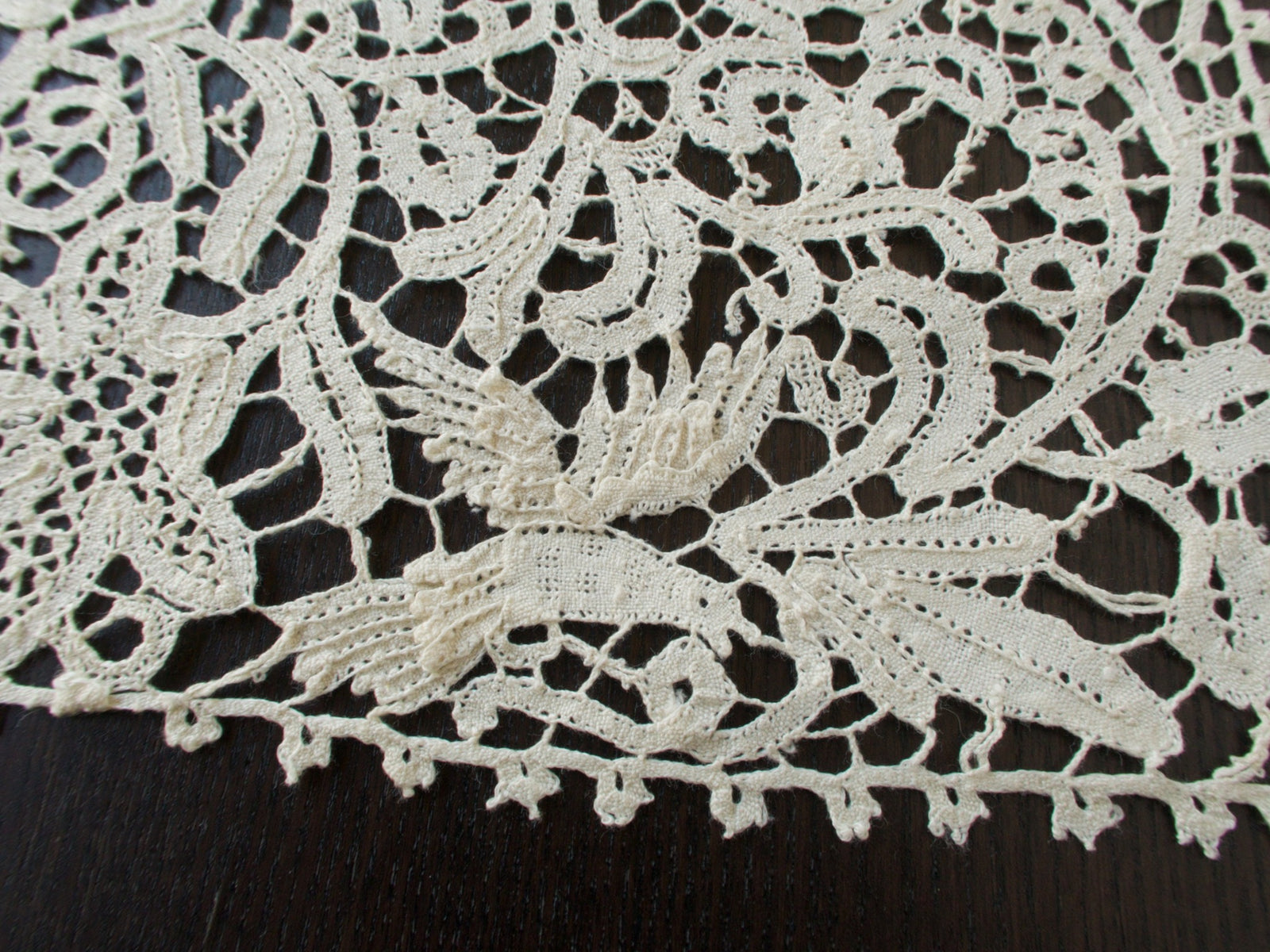 Vintage Italian bobbin lace runner featuring animals, birds and figures.