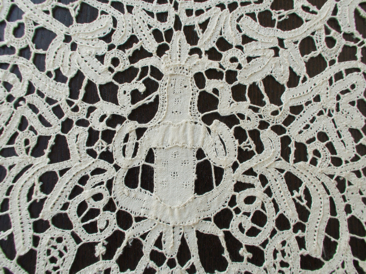 Vintage Italian bobbin lace runner featuring animals, birds and figures.