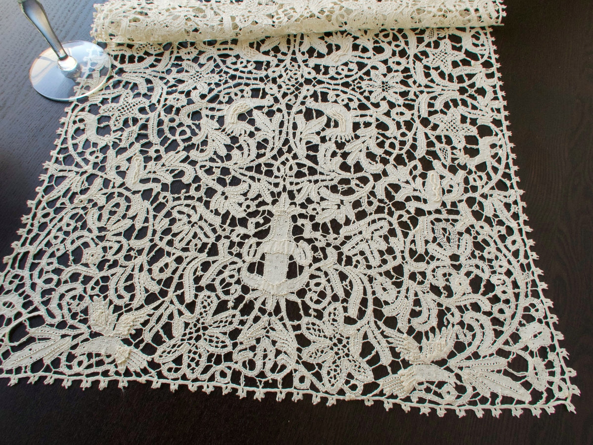 Vintage Italian bobbin lace runner featuring animals, birds and figures.