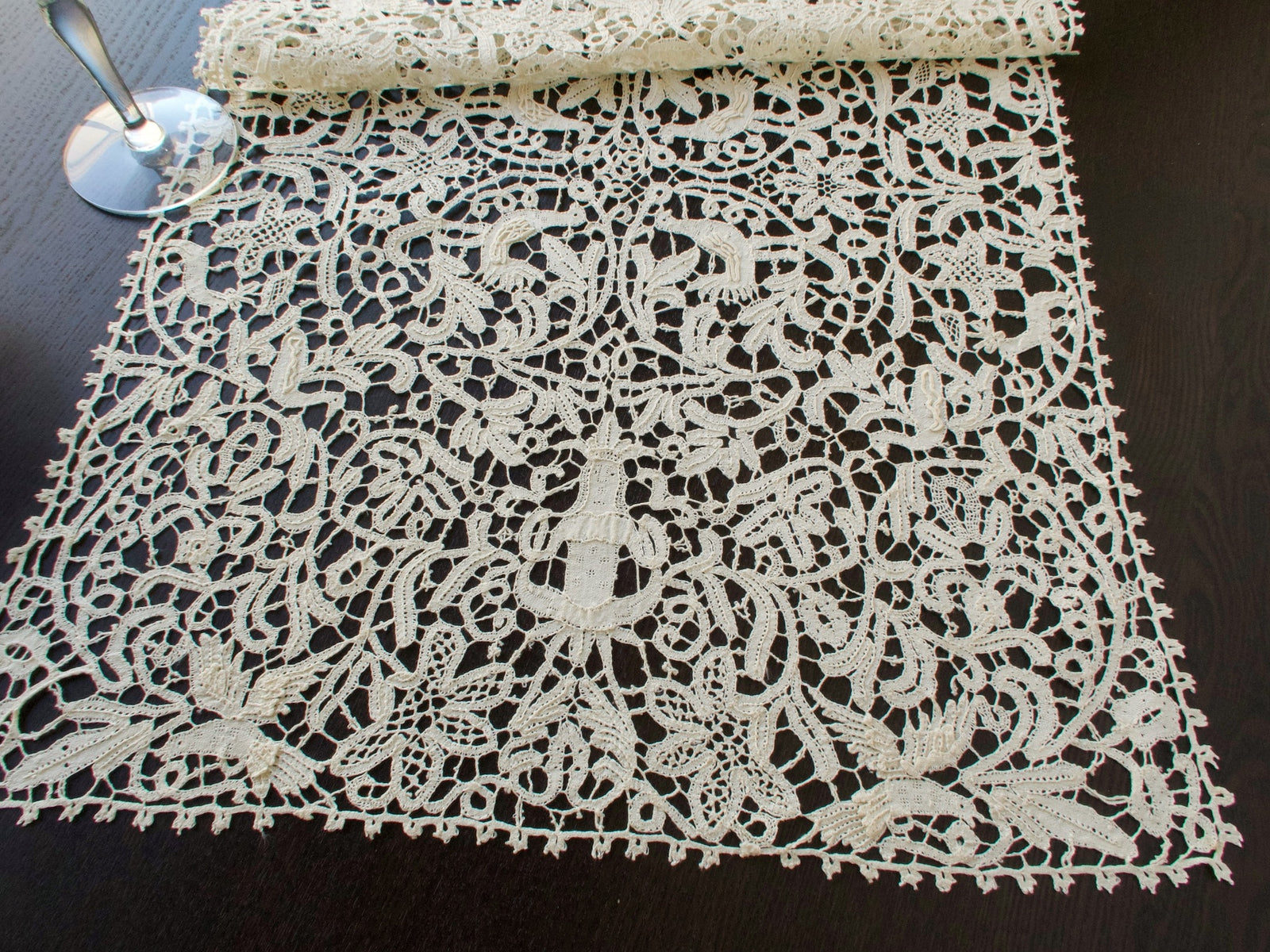 Vintage Italian bobbin lace runner featuring animals, birds and figures.