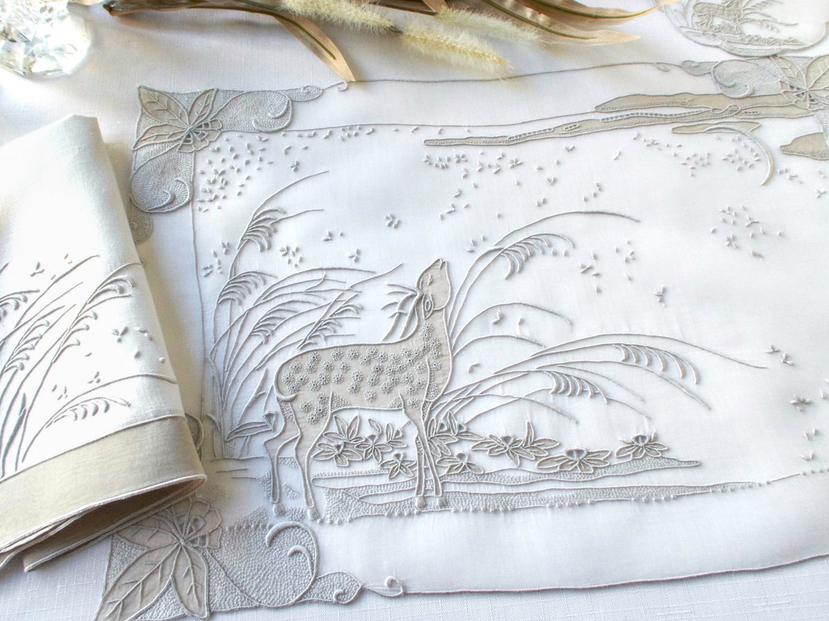 Marghab “Deer” placemat and folded linen napkin, showing placemat organdy fabric texture and design.