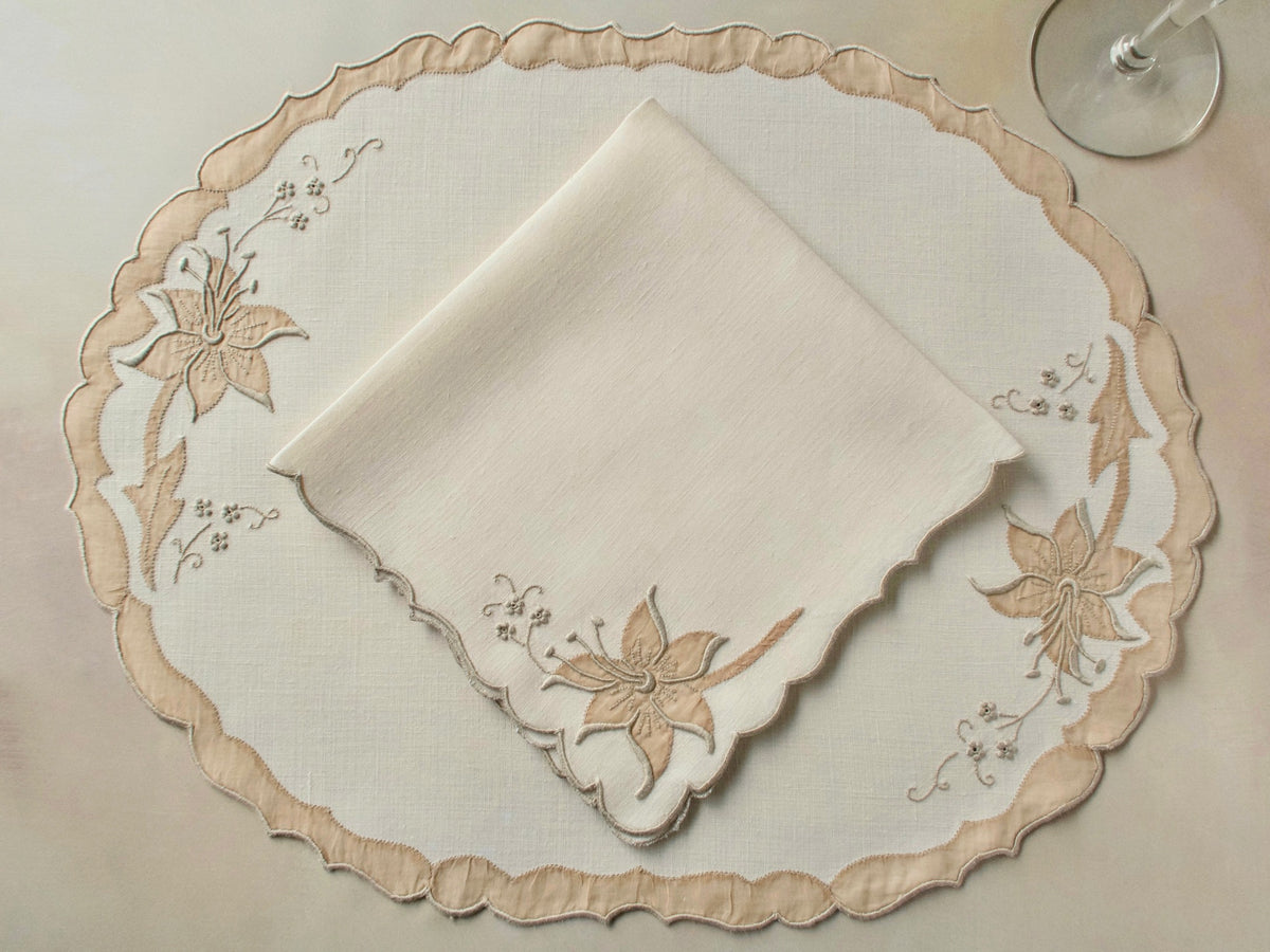 Vintage Madeira oval placemat with folded napkin, ecru linen with dimensional lily in organdy appliqué and elaborately scalloped border with organdy appliqué