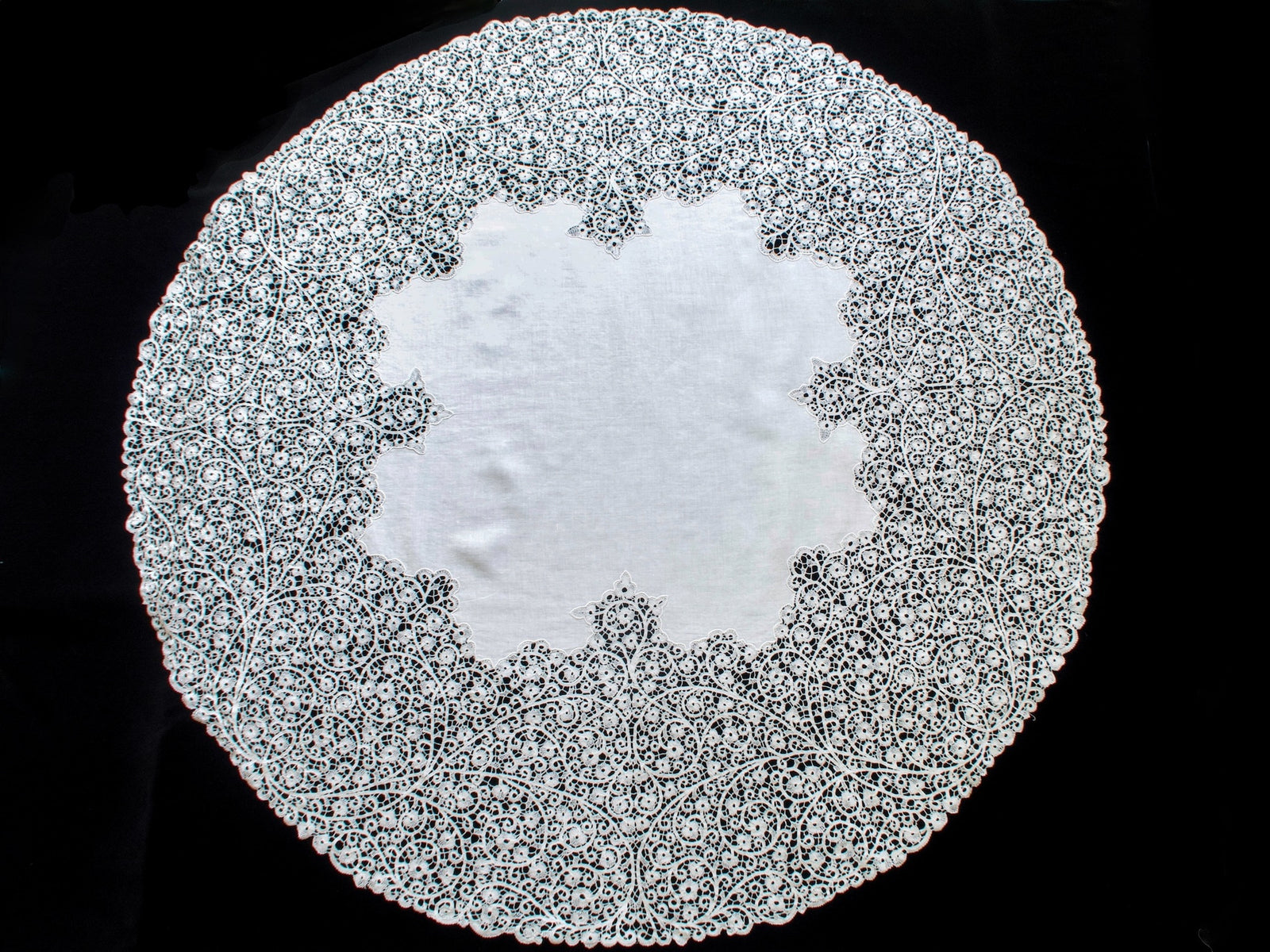 Full overhead view of the 42-inch round tablecloth, with a linen center surrounded by lace.