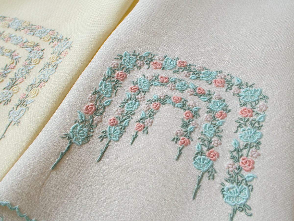 Closeup of two vintage Marghab guest towels displaying Rose Arbor pattern in complementary colorways.