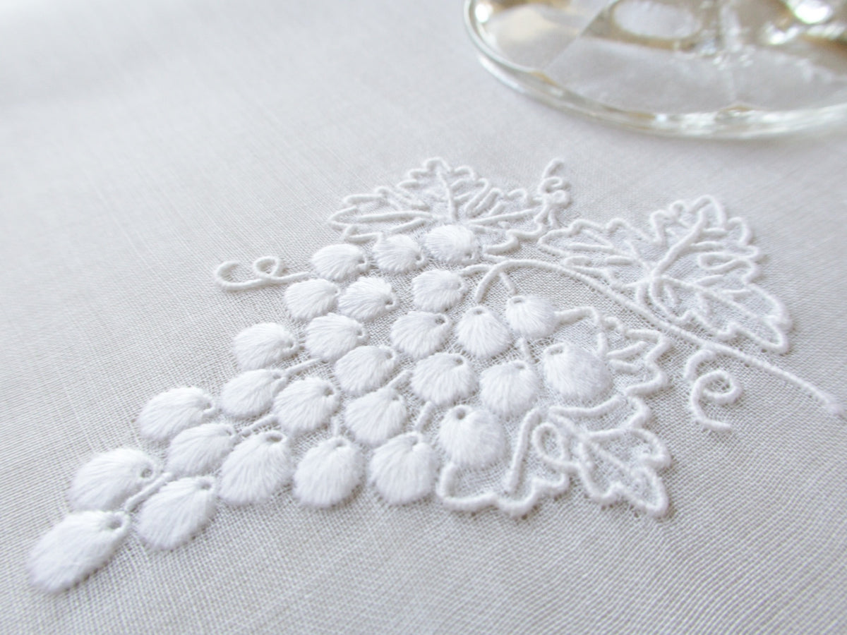 White Marghab Grape &amp; Leaf cocktail napkin, hand embroidered on sheer organdy with raised grape cluster design.