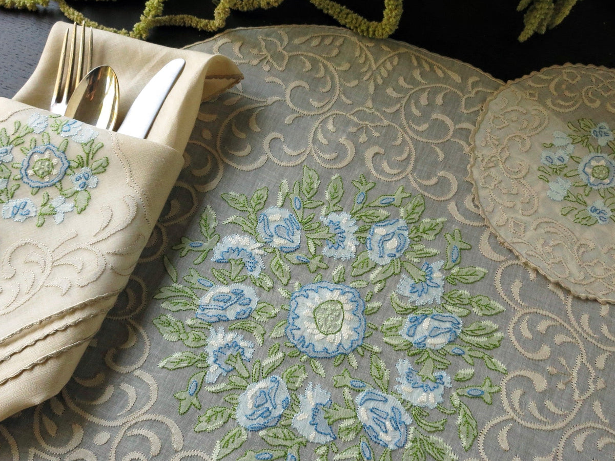 Vintage Madeira linen placemat and napkin with blue and green floral embroidery, hand embroidered in shadow work on organdy.