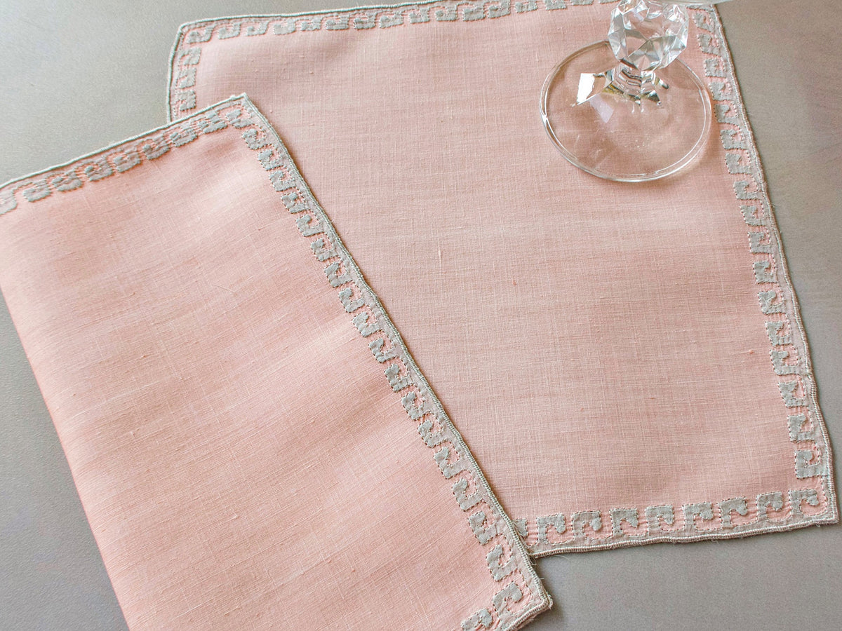 Coral Marghab Grecian Border cocktail napkins, hand embroidered on linen with classic geometric border design.