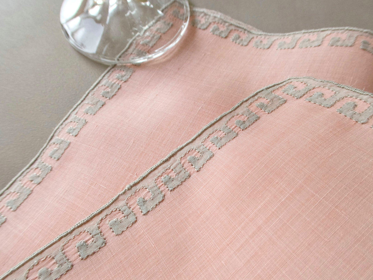 Coral Marghab Grecian Border cocktail napkins, hand embroidered on linen with classic geometric border design.