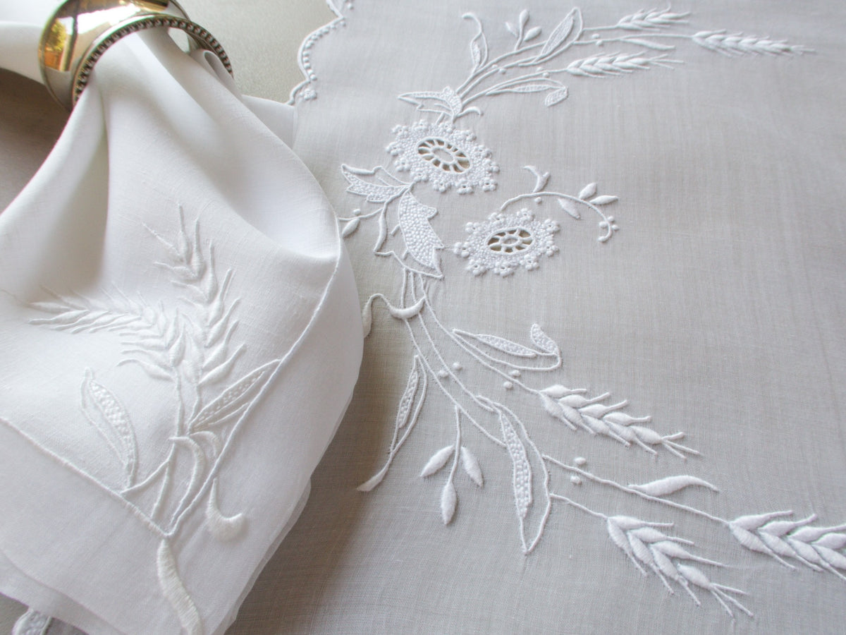 Close-up of Marghab Wheat raised embroidery on white organdy placemat, Madeira handwork detail.