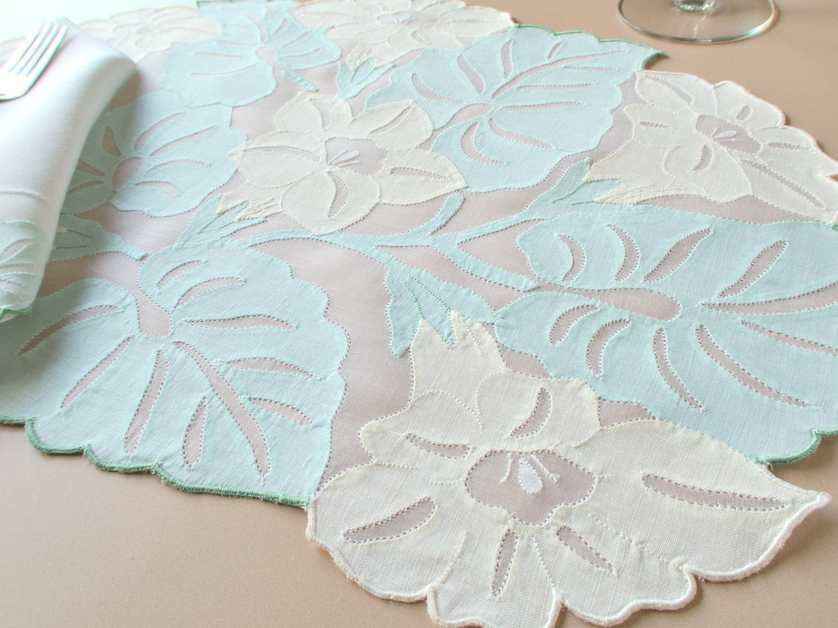Vintage Madeira organdy placemat with dimensional embroidered tropical flowers and leaves in soft pastel turquoise and yellow, scalloped edges, set for 12.