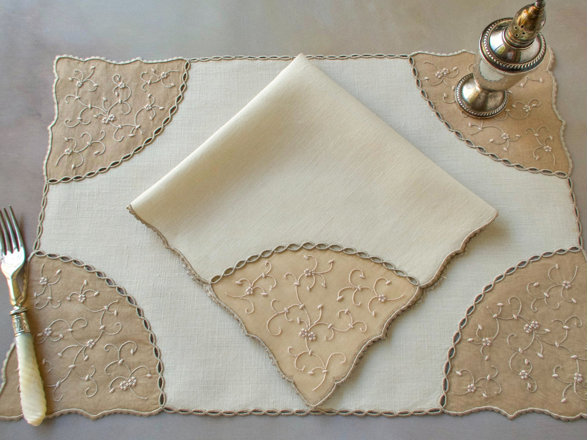 Vintage Marghab “Open Lacing” placemat and napkin set, hand embroidered in Madeira on fine linen and organdy with tone-on-tone floral motifs and delicate caseado bastido edges.