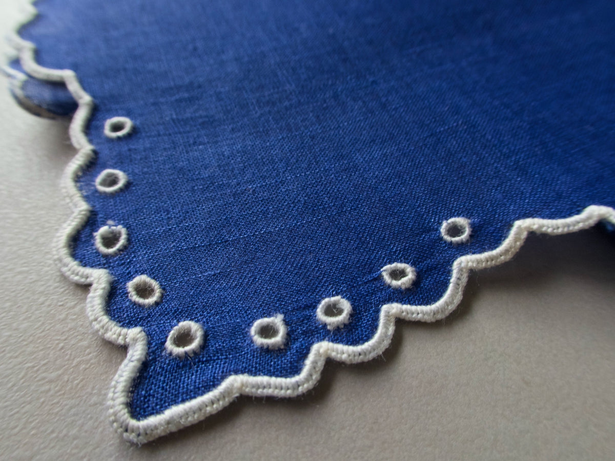 Vintage Marghab “Simple Eyelet” handkerchief, hand embroidered in white on vibrant blue linen, featuring scalloped edges and circular eyelet detailing.