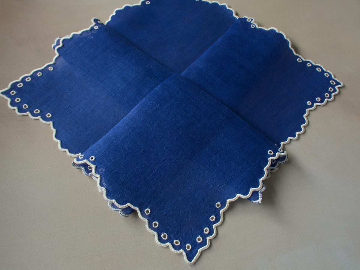 Vintage Marghab “Simple Eyelet” handkerchief, hand embroidered in white on vibrant blue linen, featuring scalloped edges and circular eyelet detailing.