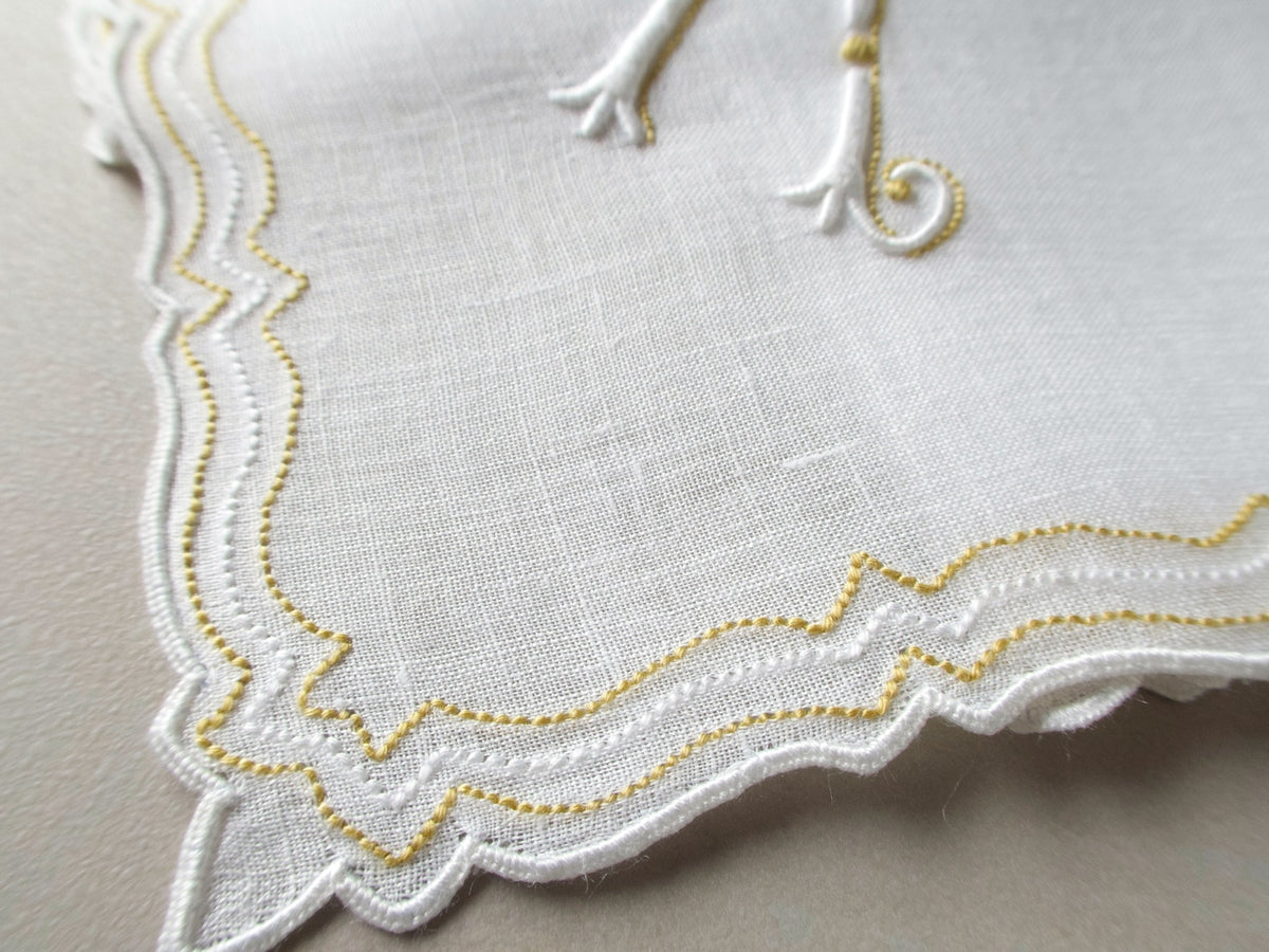 Vintage Marghab handkerchief in the “Initials” pattern, featuring a gold-embroidered “K” monogram with scalloped white border on fine linen. Hand embroidered in Madeira.