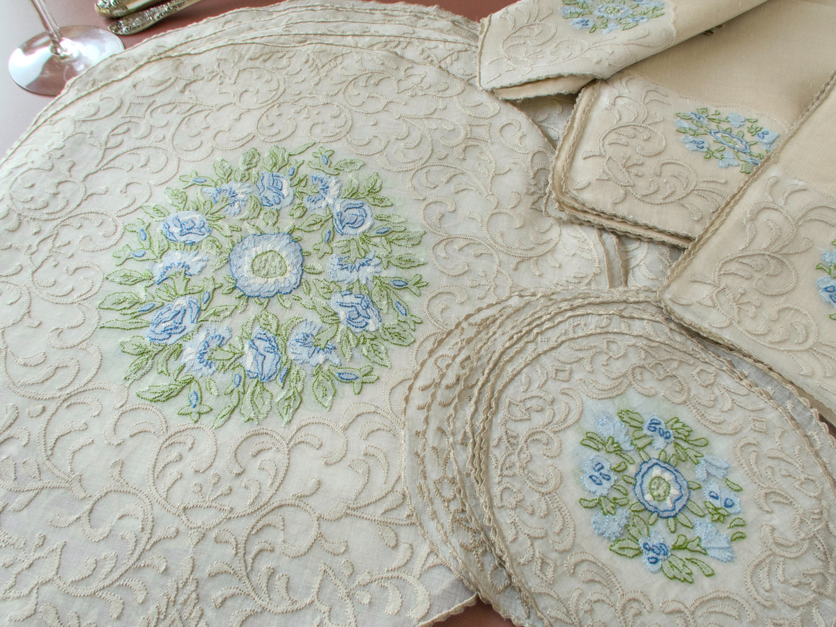 Madeira shadow work placemat set components, round organdy placemat with stacked coaster, blue floral embroidery