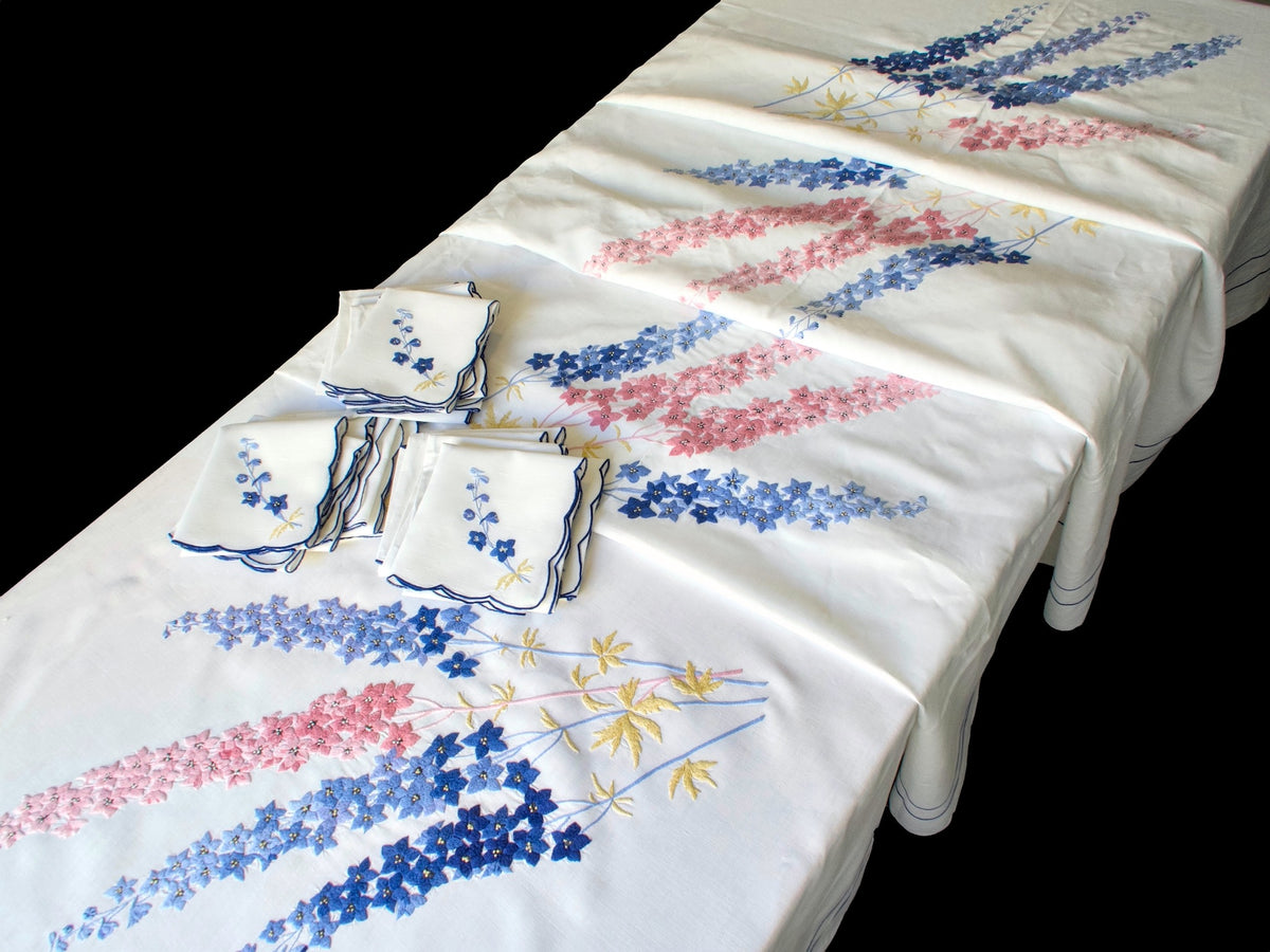 Vintage hand embroidered long French tablecloth with delphinium garlands running the full length and matching napkins