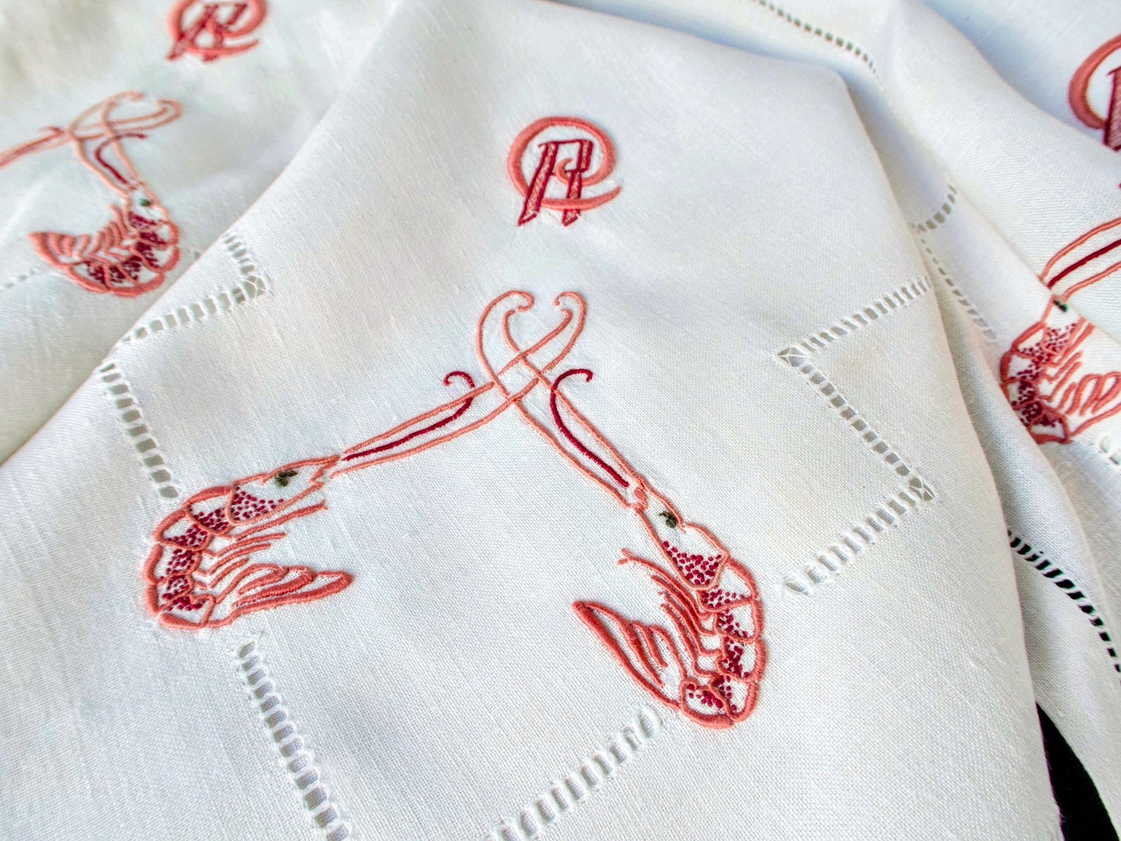 Monogram and langoustine detail on antique French linen napkin circa 1900
